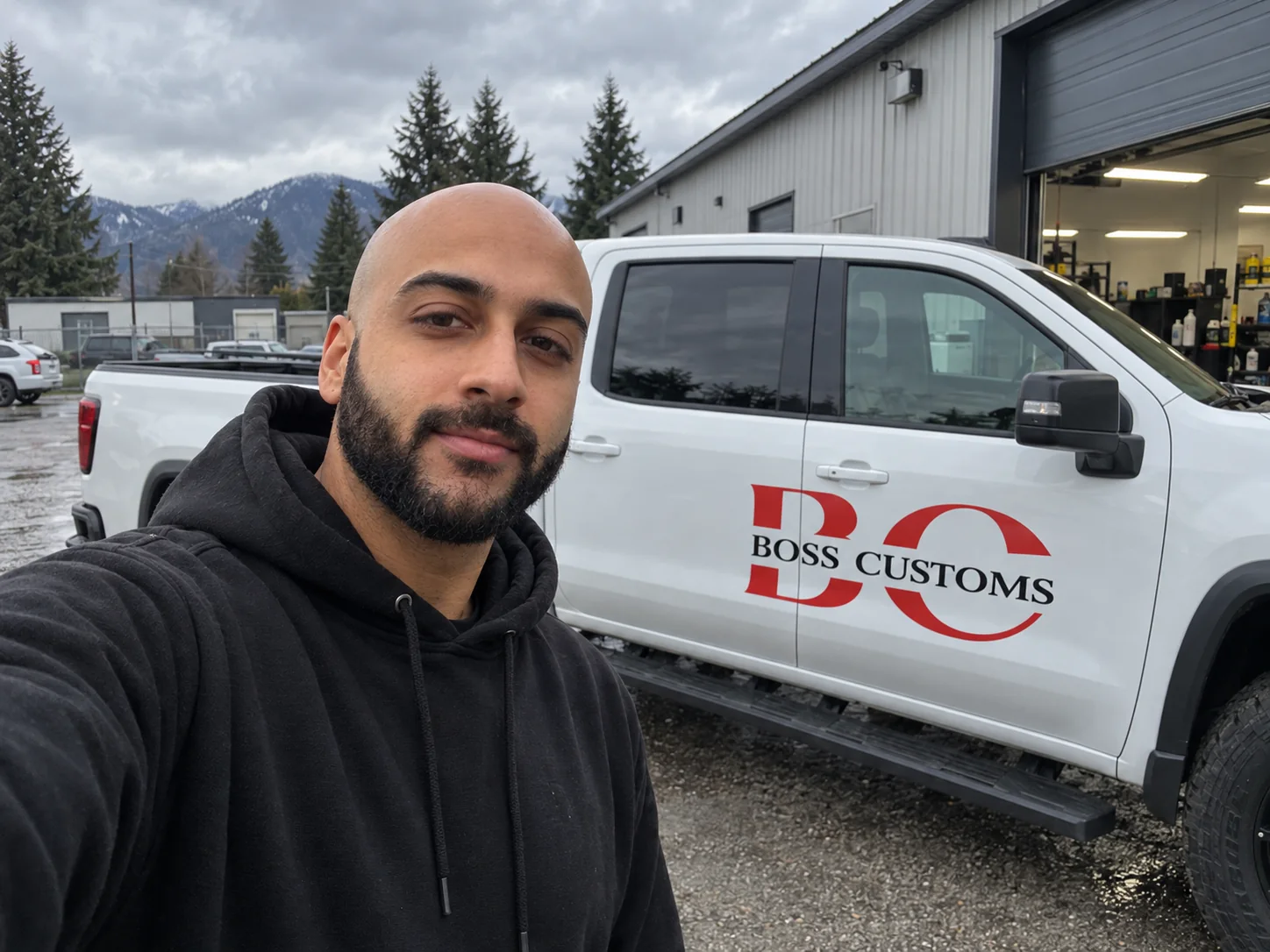 Jason, owner of Boss Customs, beside his mobile detailing truck in Chilliwack, BC