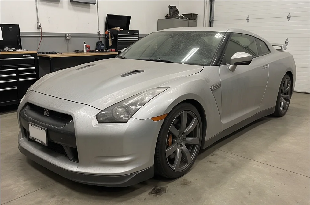 A silver Nissan GT-R with dusty paint before ceramic coating preparation in Chilliwack, BC