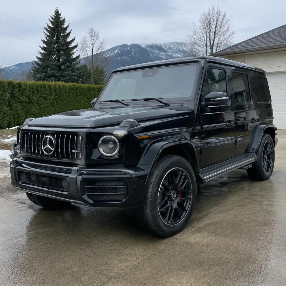 Black SUV after exterior detailing with glossy clean paint and dressed tires in Chilliwack, BC