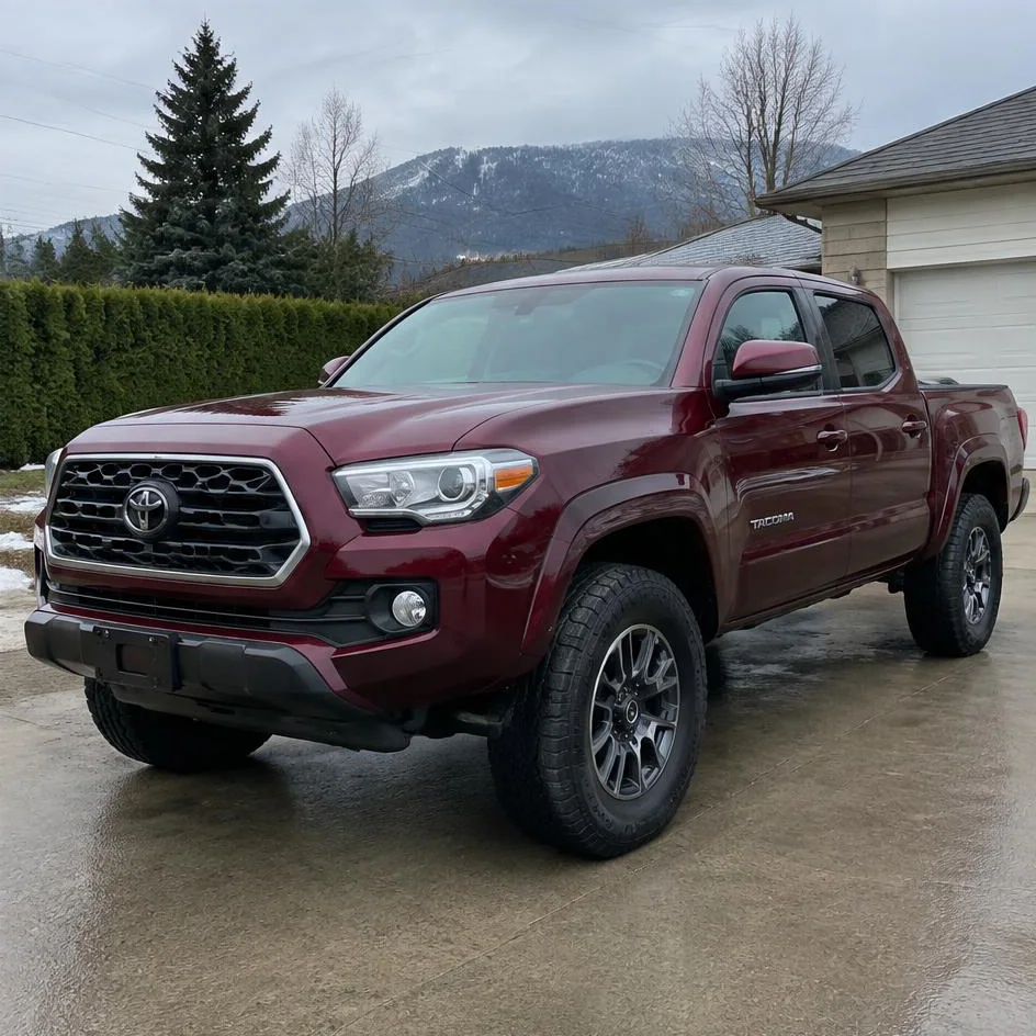 Dark red pickup truck after exterior detailing with clean glossy paint in Chilliwack, BC