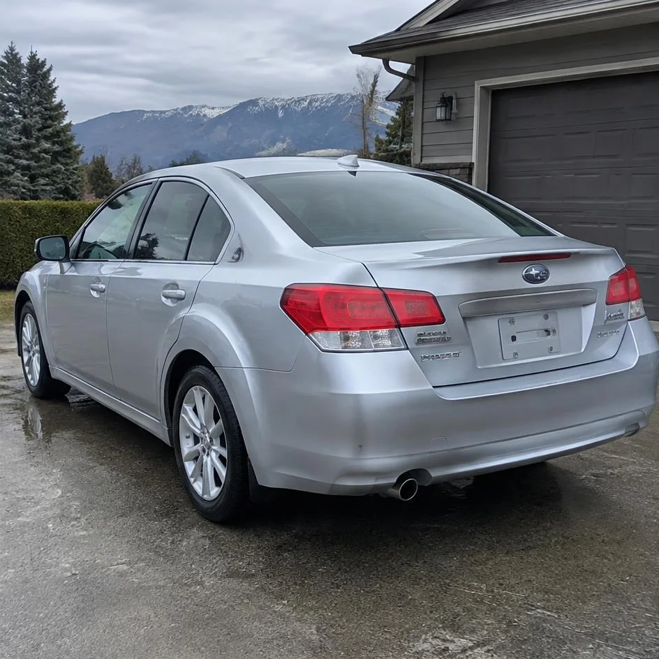 Silver sedan after exterior detailing with glossy paint, clean glass and wheels in Chilliwack, BC