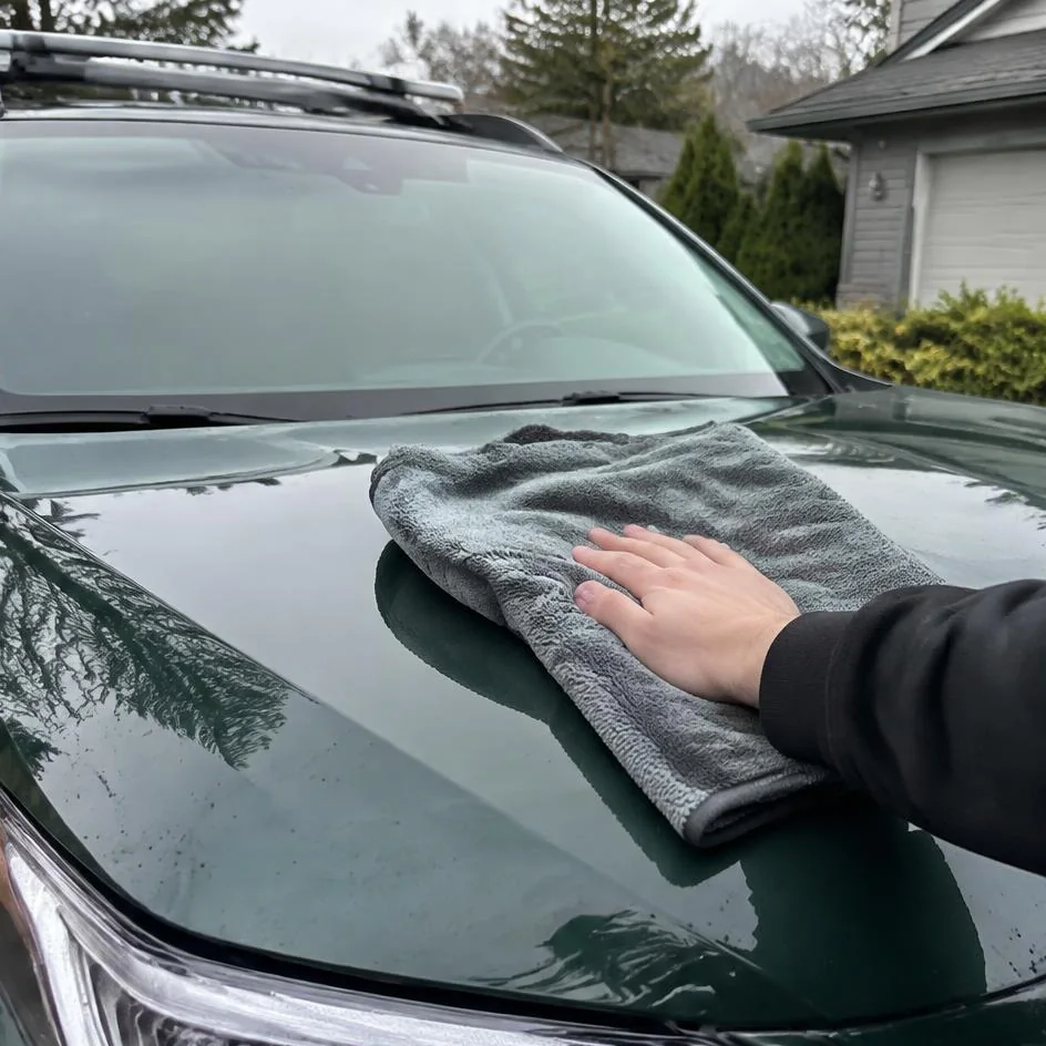 Vehicle paint being dried with a microfiber towel in Chilliwack, BC