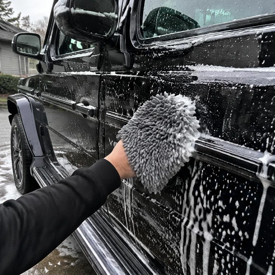 Foamed black vehicle hand washed with a microfiber mitt in Chilliwack, BC