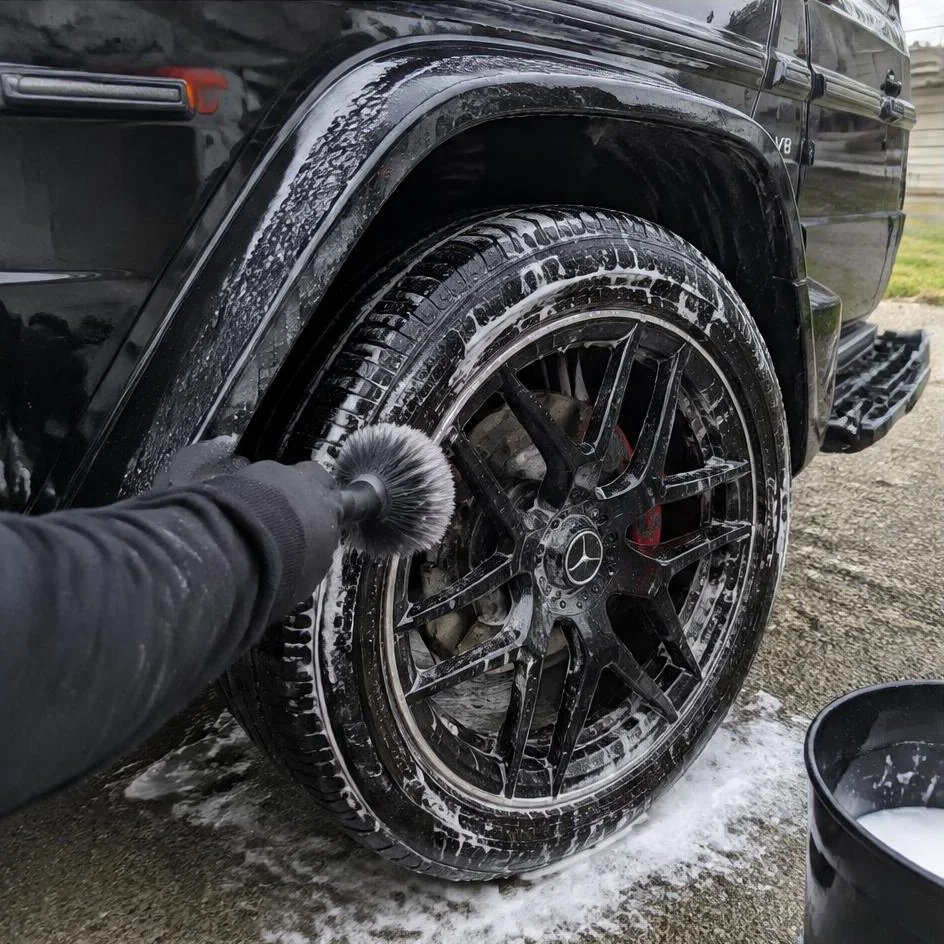 Wheel and tire being detailed with a soft brush in Chilliwack, BC