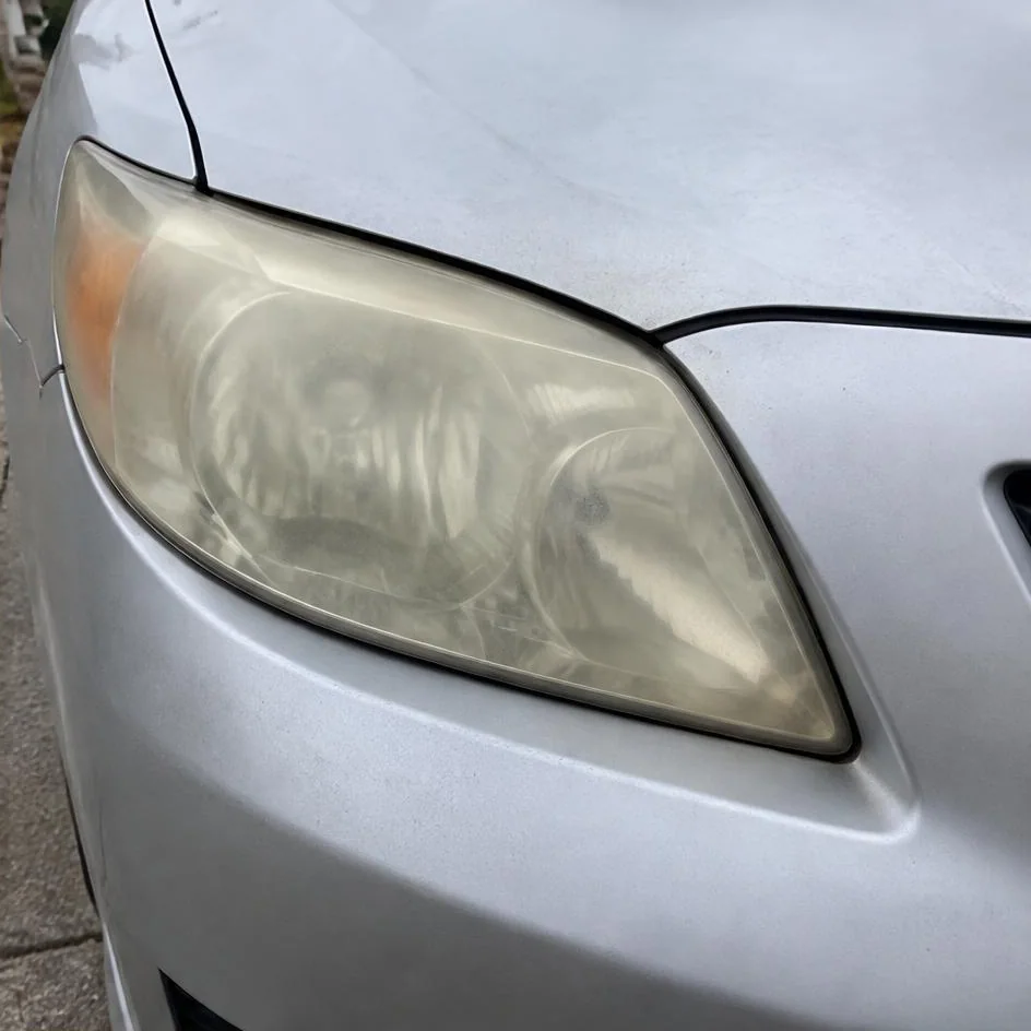 Cloudy yellow automotive headlight before restoration in Chilliwack, BC