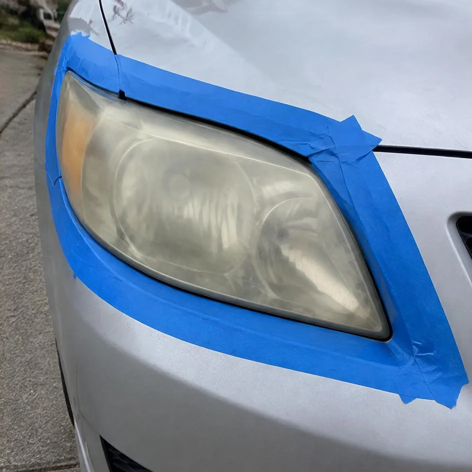 Headlight and surrounding paint carefully masked in Chilliwack, BC
