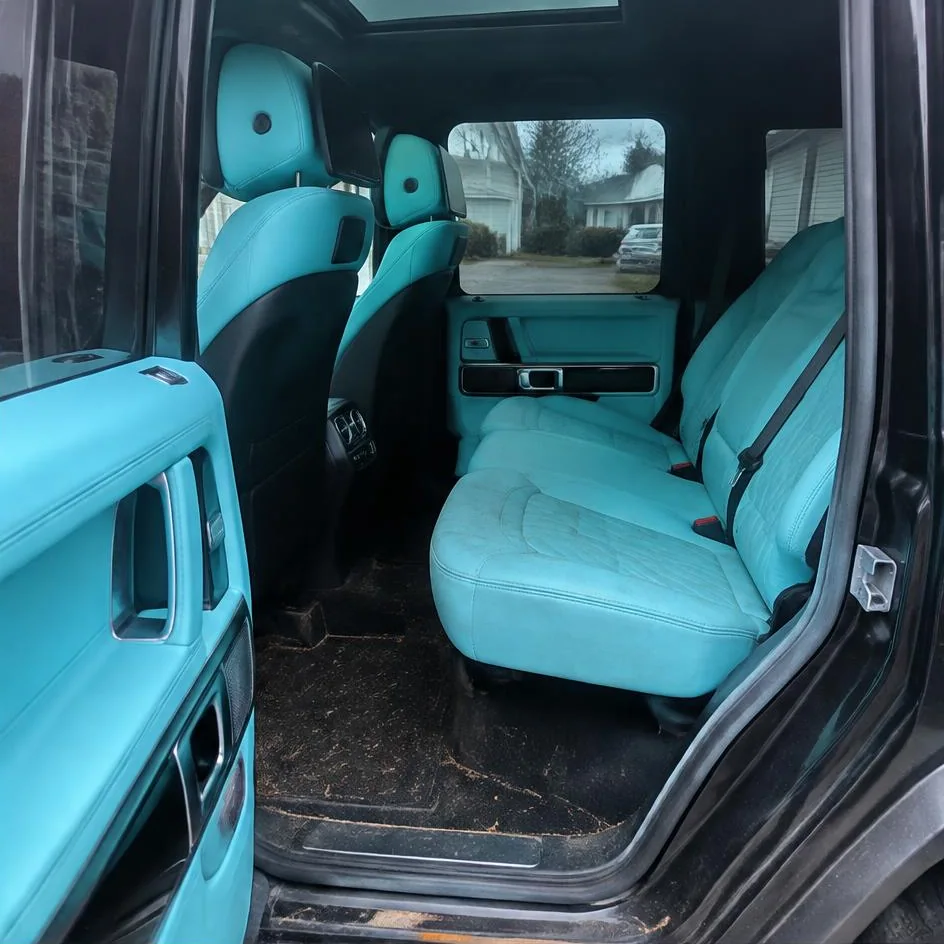Vehicle interior before detailing with stained mats and dusty dashboard in Chilliwack, BC
