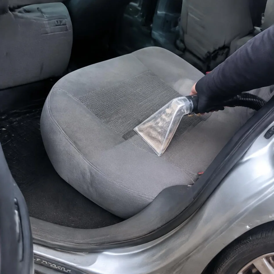 Hot water extraction lifting dirt out of a fabric car seat in Chilliwack, BC