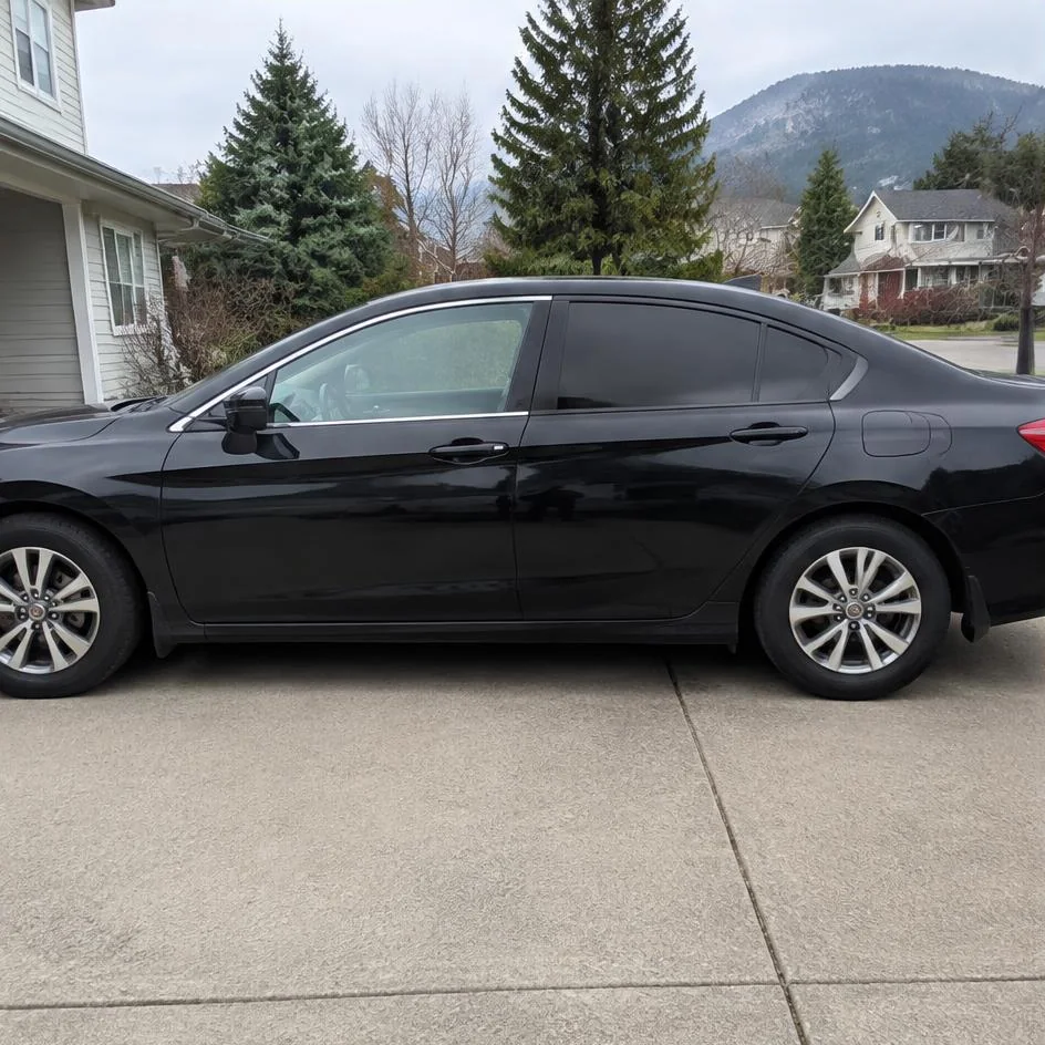 Sedan showing untinted front glass and tinted rear glass in Chilliwack, BC