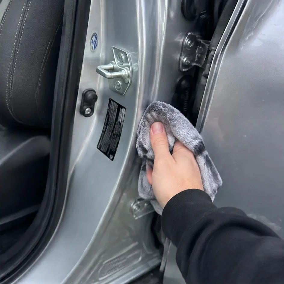 Door jamb being wiped clean with a microfibre towel in Chilliwack, BC
